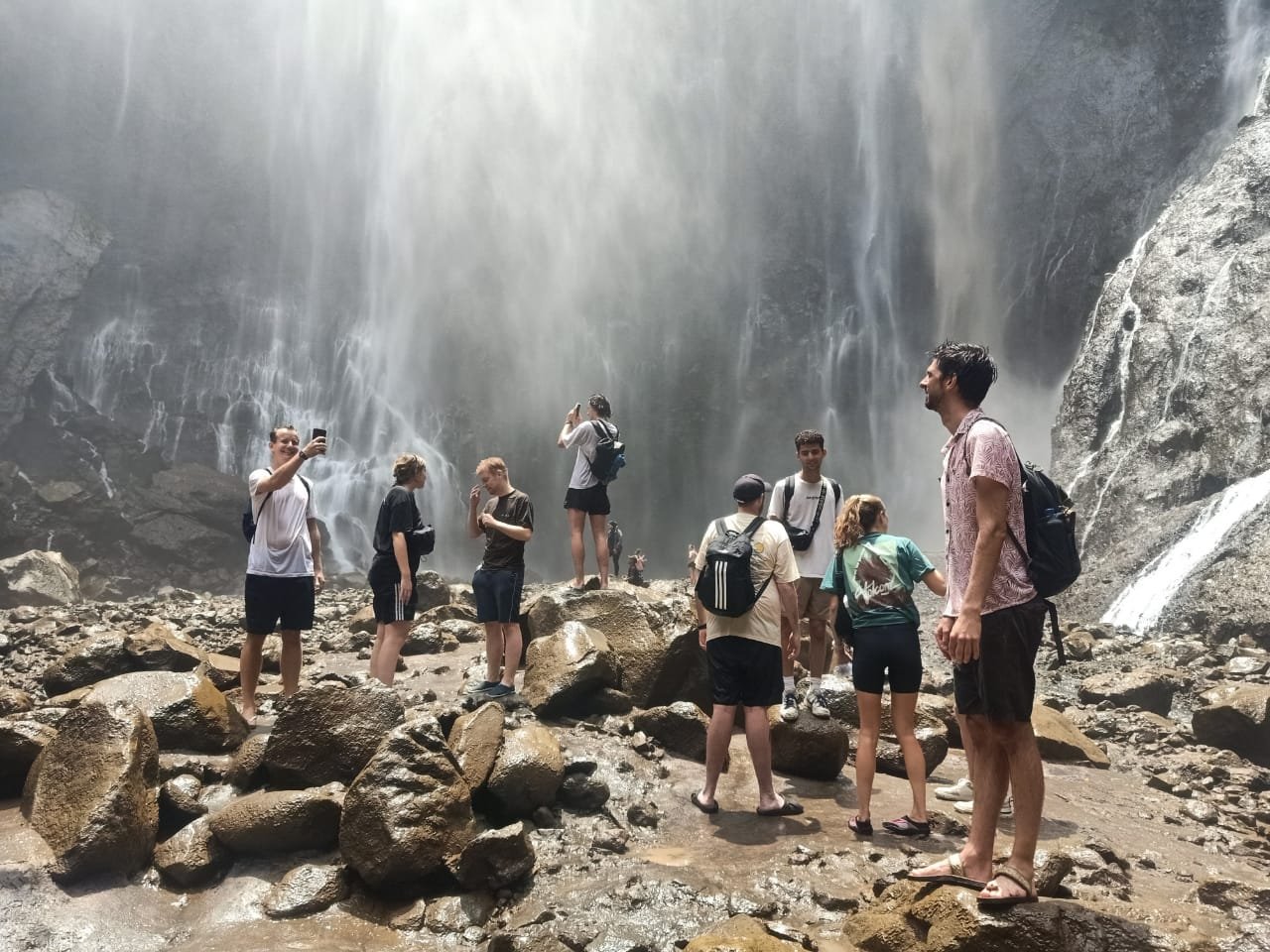 Tumpak Sewu Waterfall viewed from the valley below in Lumajang