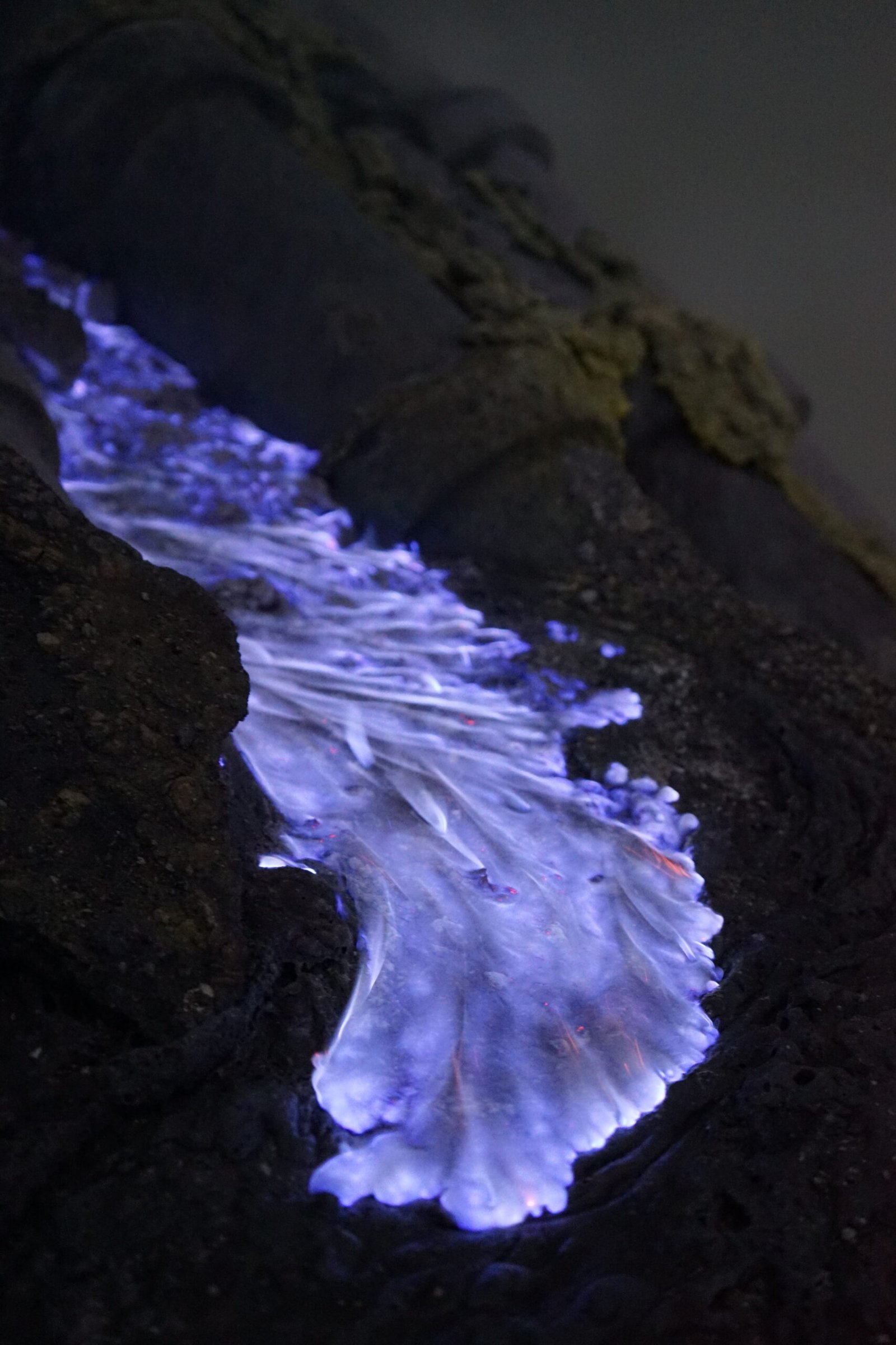 Blue sulfur flames at Kawah Ijen before sunrise