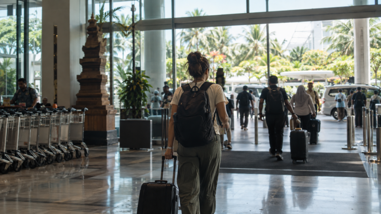 Traveler with luggage arriving at an Indonesian airport