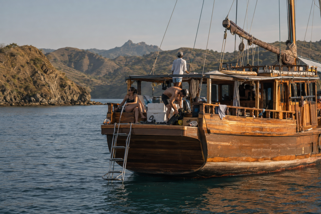 Traditional phinisi liveaboard boat between the islands of Komodo National Park.