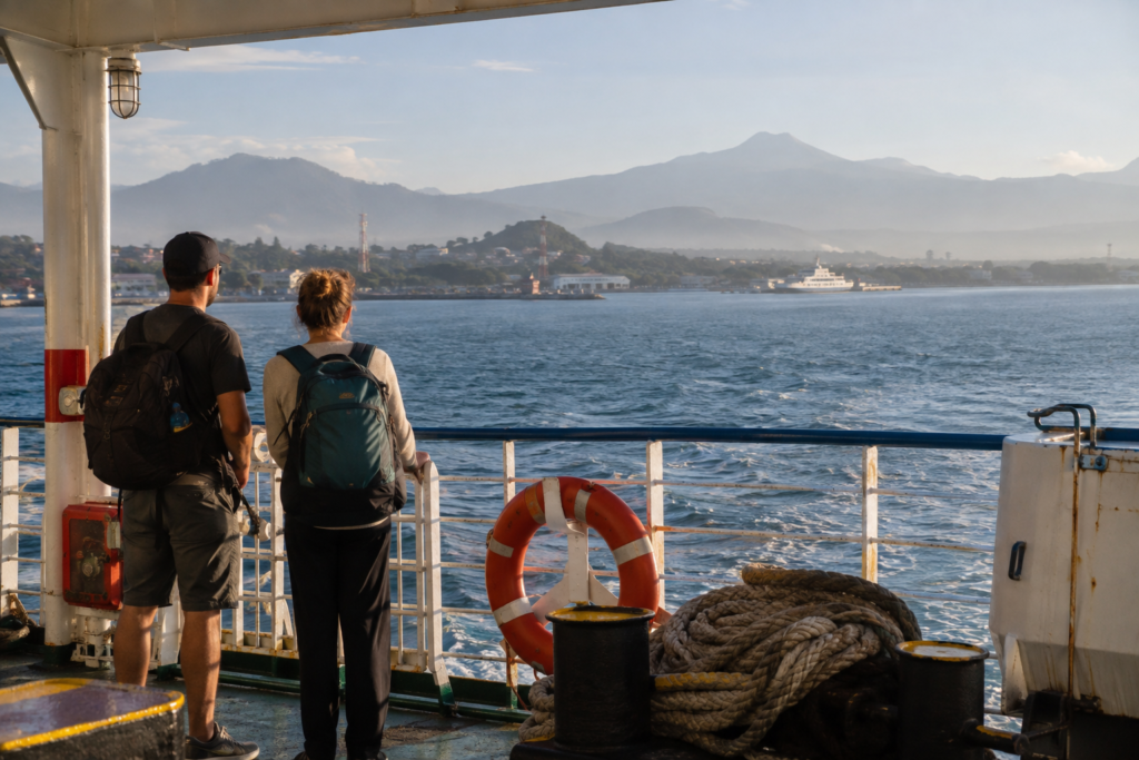 Travelers crossing between Indonesian islands on a practical ferry.